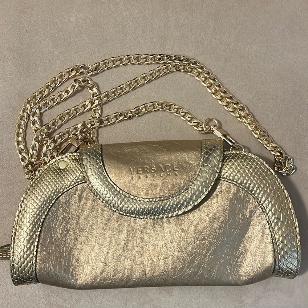 Versace Gold beaute crossbody bag 9”x5”. New